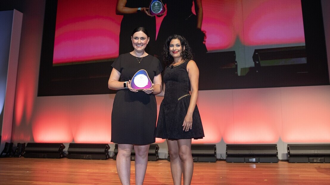 Jo Fahy accepts the award from Nadira Tudor